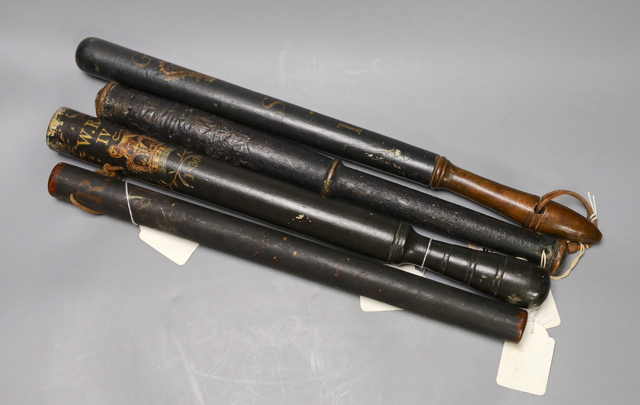 An early 19th century ‘cudgel’ truncheon a George IV painted ‘crown and honour’ truncheon, a George III painted truncheon and another William IV painted truncheon